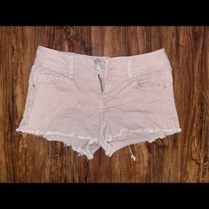 Light tan/pink shorts.